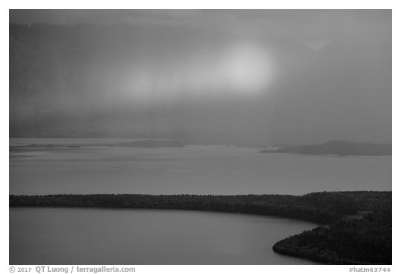 Rainbow in sun shaft piercing clouds. Katmai National Park (black and white)