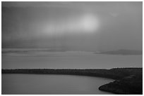 Rainbow in sun shaft piercing clouds. Katmai National Park ( black and white)