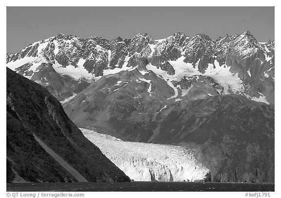 Aialik Glacier, fjord,  and steep mountains. Kenai Fjords National Park, Alaska, USA.