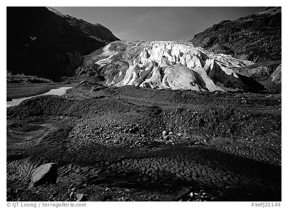 Dark glacial plain floor and Exit Glacier. Kenai Fjords National Park, Alaska, USA.