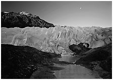 Front of Exit Glacier, sunrise and moon. Kenai Fjords National Park, Alaska, USA. (black and white)