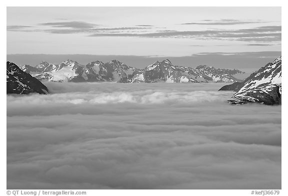Resurrection Mountains emerging from clouds at sunset. Kenai Fjords National Park (black and white)