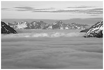 Resurrection Mountains emerging from clouds at sunset. Kenai Fjords National Park, Alaska, USA. (black and white)