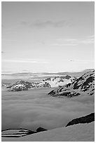 Snowy mountains and see of clouds at sunset. Kenai Fjords National Park, Alaska, USA. (black and white)