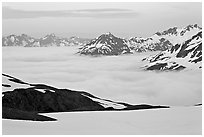 Mountains above low fog at dusk. Kenai Fjords National Park, Alaska, USA. (black and white)