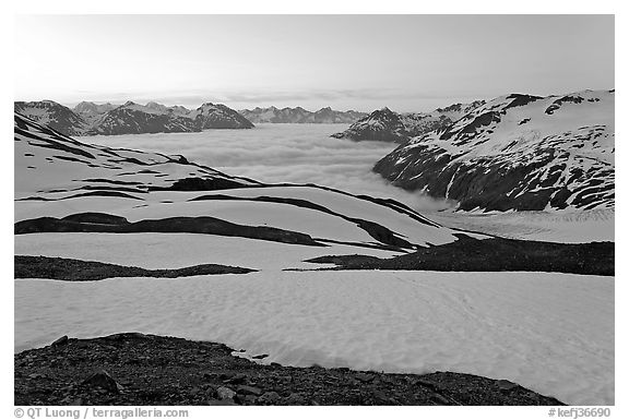 Bands freshly uncovered by snow, and low clouds, sunrise. Kenai Fjords National Park (black and white)