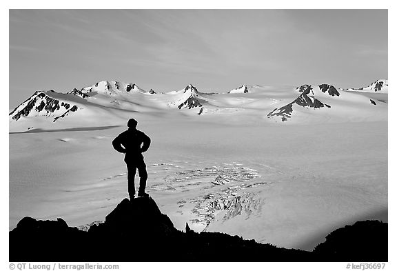 Man standing on overlook above Harding ice field, early morning. Kenai Fjords National Park (black and white)