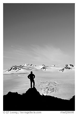 Hiker standing on overlook above Harding icefield. Kenai Fjords National Park (black and white)