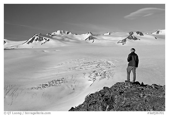 Man looking at the Harding ice field, early morning. Kenai Fjords National Park (black and white)