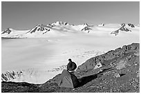 Tent and backpacker above the Harding icefield. Kenai Fjords National Park, Alaska, USA. (black and white)