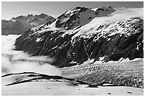 Peaks, glacier, and sea of clouds, morning. Kenai Fjords National Park, Alaska, USA. (black and white)