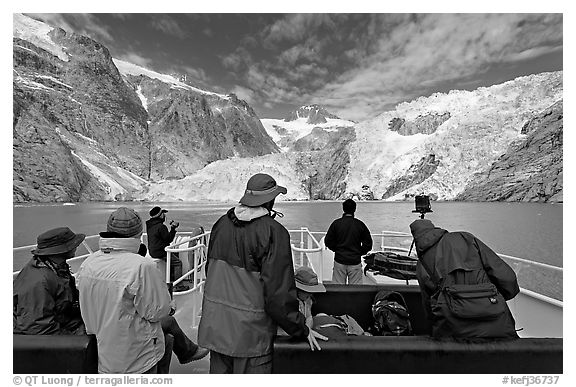 Passengers on the deck of tour boat and Northwestern glacier, Northwestern Lagoon. Kenai Fjords National Park (black and white)