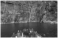 Waterfall viewing from deck of tour boat, Cataract Cove. Kenai Fjords National Park ( black and white)