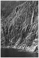 Waterfalls streaming into cove, Northwestern Fjord. Kenai Fjords National Park, Alaska, USA. (black and white)