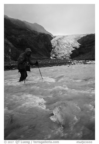 Hiker wades in  glacial stream, Exit Glacier. Kenai Fjords National Park (black and white)
