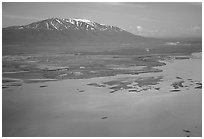 Aerial view of estuary and snowy peak. Lake Clark National Park, Alaska, USA. (black and white)