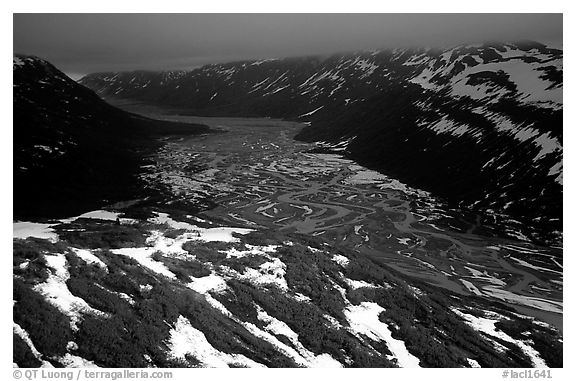 Aerial view of Tikakila River valley under dark clouds. Lake Clark National Park (black and white)