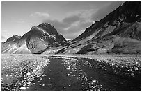 Wide gravel river bar below the Telaquana Mountains, sunset. Lake Clark National Park, Alaska, USA. (black and white)