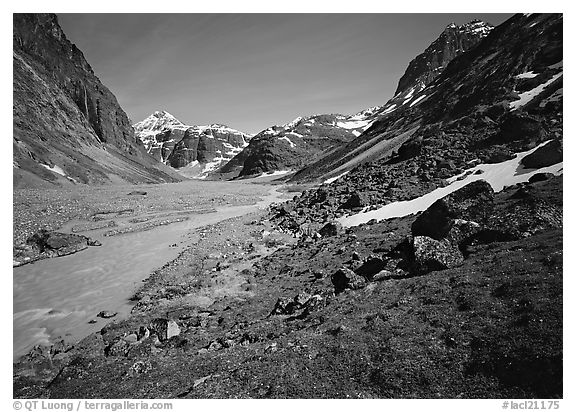 Stream and distant waterfall in valley below Telaquana Mountains. Lake Clark National Park (black and white)