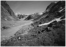 Stream and distant waterfall in valley below Telaquana Mountains. Lake Clark National Park ( black and white)