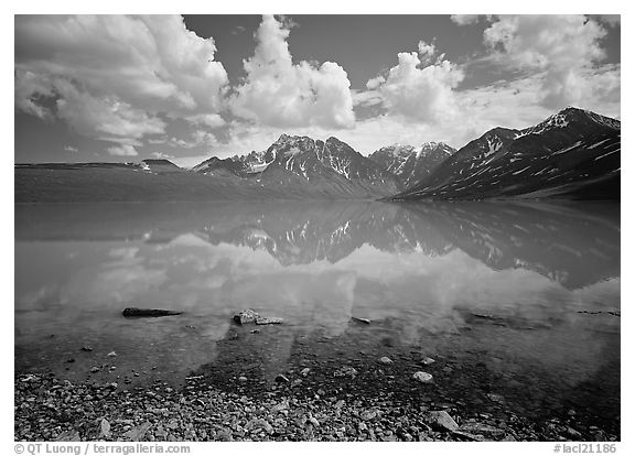 Clouds and Telaquana Mountains above Turquoise Lake, from the middle of the lake. Lake Clark National Park, Alaska, USA.