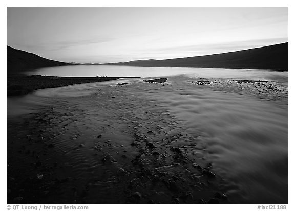 Stream flows into Turquoise Lake, midnight sunset. Lake Clark National Park (black and white)