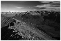 Visitor looking, summit of Tanalian Mountain and Kontrashibuna Lake. Lake Clark National Park ( black and white)