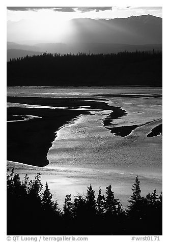 Early morning sun shining on the wide Chitina river. Wrangell-St Elias National Park, Alaska, USA.
