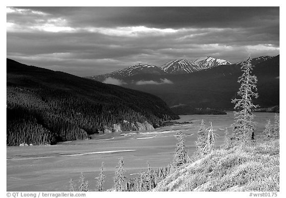 Chitina river valley, snowy peaks, and storm light. Wrangell-St Elias National Park, Alaska, USA.