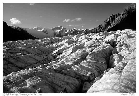 Crevasses on Root glacier, Wrangell mountains in the background, late afternoon. Wrangell-St Elias National Park, Alaska, USA.