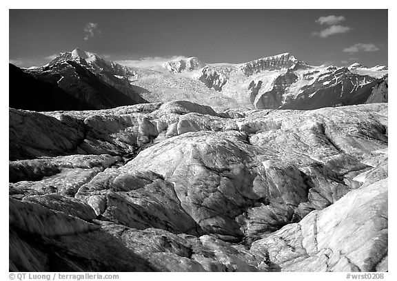 Crevasses on Root glacier, Wrangell mountains in the background. Wrangell-St Elias National Park, Alaska, USA.