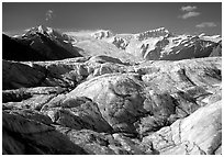 Crevasses on Root glacier, Wrangell mountains in the background. Wrangell-St Elias National Park, Alaska, USA. (black and white)