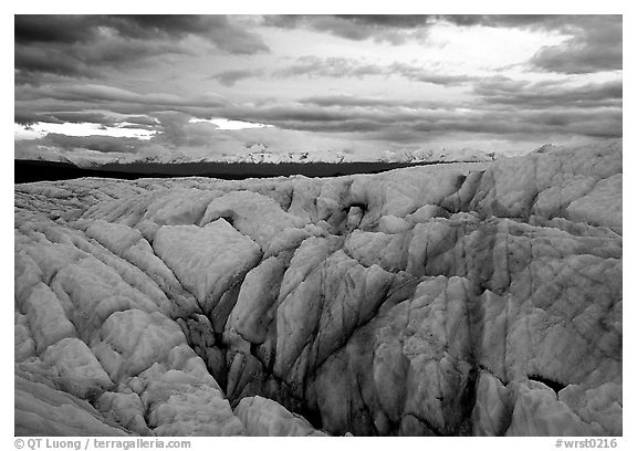 Crevasses on Root glacier at dusk, Chugach mountains in the background. Wrangell-St Elias National Park, Alaska, USA.