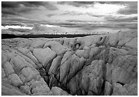 Crevasses on Root glacier at dusk, Chugach mountains in the background. Wrangell-St Elias National Park, Alaska, USA. (black and white)