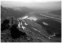 Mountaineer looking down from Mt Donoho. Wrangell-St Elias National Park, Alaska, USA. (black and white)