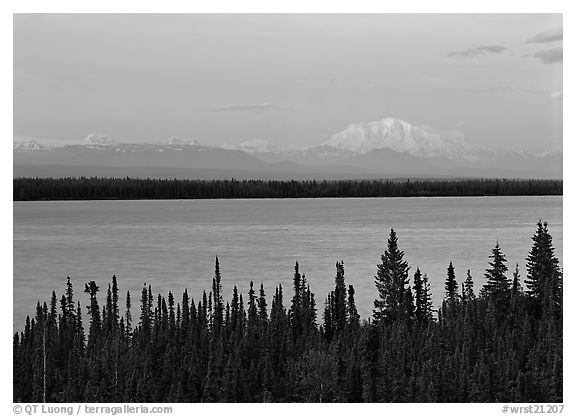 Wrangell range and Mt Blackburn above Willow Lake with pink sunset hues. Wrangell-St Elias National Park, Alaska, USA.