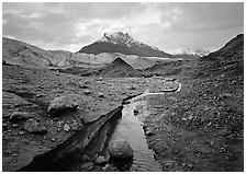 Donoho Peak above moraine, stream, and Root glacier. Wrangell-St Elias National Park ( black and white)