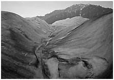 Root Glacier, glacial stream, and mountains at dusk. Wrangell-St Elias National Park, Alaska, USA. (black and white)