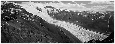 Elevated view of glacier descending from mountain. Wrangell-St Elias National Park (Panoramic black and white)