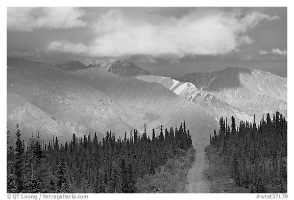 Road and Nutzotin Mountains at sunset. Wrangell-St Elias National Park, Alaska, USA.