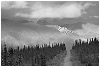 Road and Nutzotin Mountains at sunset. Wrangell-St Elias National Park, Alaska, USA. (black and white)