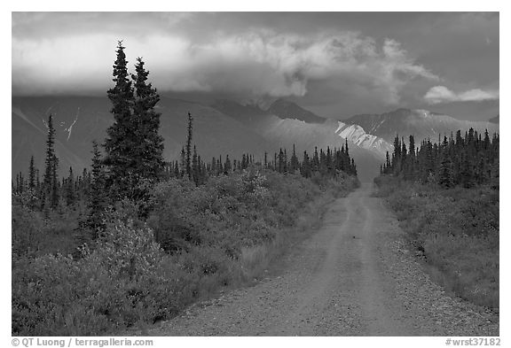 Nabena road at sunset with last light on mountains. Wrangell-St Elias National Park, Alaska, USA.