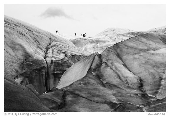 Distant hikers on Root Glacier from below. Wrangell-St Elias National Park (black and white)