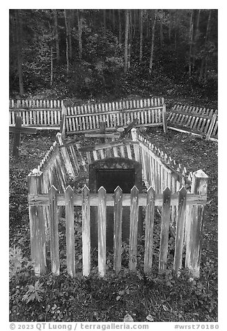 Headstone in grave fenced with white pickets, Kennecott cemetery. Wrangell-St Elias National Park, Alaska, USA.