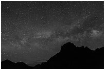 Starry sky and Milky Way above Chisos Mountains. Big Bend National Park ( black and white)