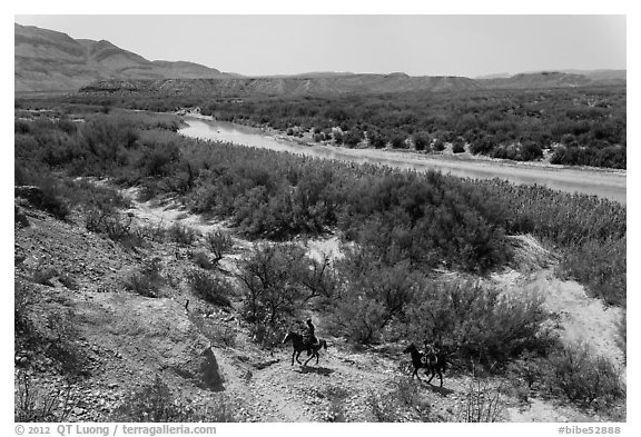 Mexican nationals crossing border on horse. Big Bend National Park, Texas, USA.