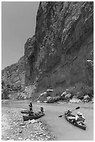 Canoeists bellow steep walls of Boquillas Canyon. Big Bend National Park, Texas, USA. (black and white)