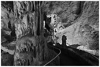 Path passing next to huge stalagmite. Carlsbad Caverns National Park, New Mexico, USA. (black and white)