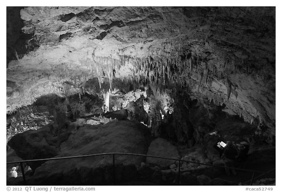 Tourists looking at Green Lake room from above. Carlsbad Caverns National Park (black and white)