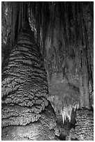 Stalagmite and flowstone framing chandelier. Carlsbad Caverns National Park, New Mexico, USA. (black and white)